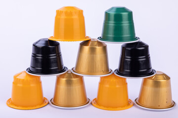 Diverse Coffee Capsules Arranged in a Pyramid Shape