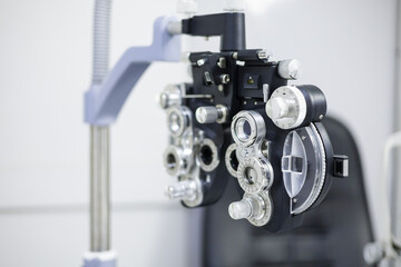 Optometrist phoropter optical correcting device tools and equipment use to diagnose, examine and treat patients eyes optical vision. Professional specialist optician eye tool.