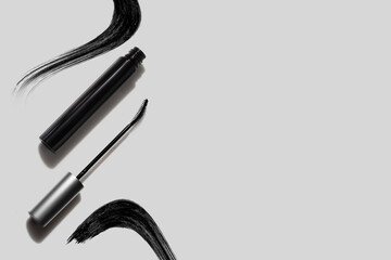 mascara and eyeliner with smudge stroke paint for makeup cosmetic product mockup on white background