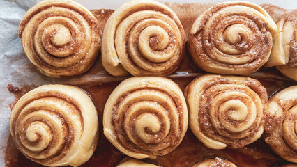 freshly baked cinnabons anointed with soft cream, homemade pastries, dessert