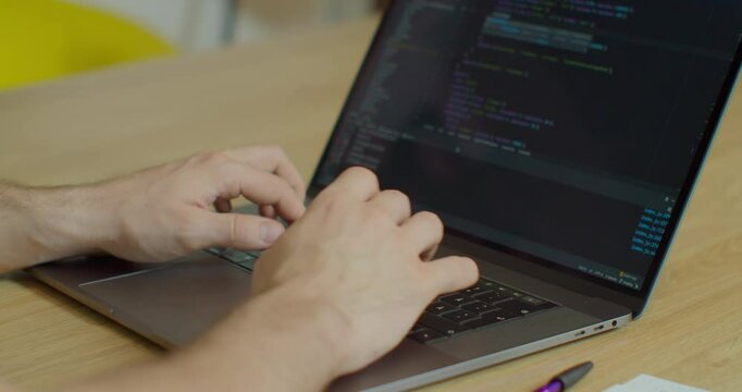 Closeup coding on screen, Man hands coding html and programming on screen laptop, development web, developer.