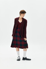 A woman dressed in elegant winter fashion showcases her cozy, sophisticated style indoors.