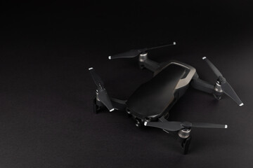 Drone unmanned aircraft on textured background. Modern FPV drone on background. The drone...