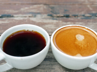 Two coffee cup, Americano coffee and espresso coffee on wooden table