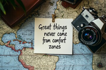 A handwritten note with the quote "Great things never come from comfort zones" pinned to a world map on a traveler's desk, with camera nearby, symbolizing the courage to step outside 