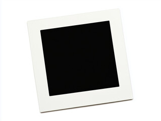 Empty black vintage style polaroid instant photo with bright on white background with copy space for use as graphical resource