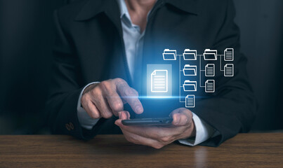 Businessman working with Document Management System (DMS), online documentation database and process automation to efficiently manage files, Corporate business technology.