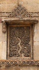 Intricate and delicate stone carvings on the wall of Jama Masjid, 15th-century stone carvings, Ahmedabad, Gujarat, India.
