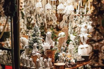 Sales of Christmas decorations on the traditional Christmas market. Christmas and New Year decoration decorative white toy.