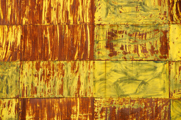 Textured Metal Surface with Yellow and Rust Colors