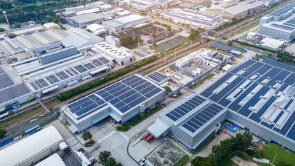 Top view Solar Cell on Warehouse Factory. Solor photo voltaic panels system power or Solar Cell on industrial building roof for producing green ecological electricity. Production of renewable energy.