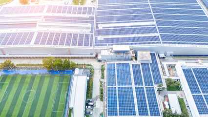Top view Solar Cell on Warehouse Factory. Solor photo voltaic panels system power or Solar Cell on industrial building roof for producing green ecological electricity. Production of renewable energy. © Yellow Boat