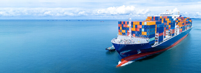 Front view of Cargo container ship carrying container and running out international container port customs shipyard sea port concept smart logistic service.. © Yellow Boat