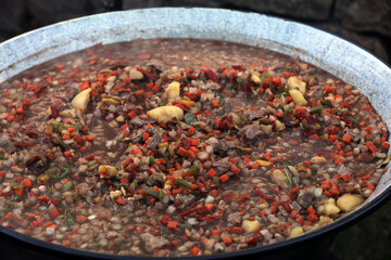Vegetables and goulash in a goulash pot