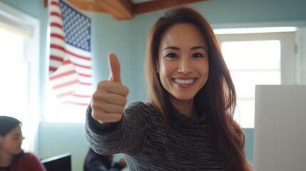 Smiling woman giving thumbs up in a community center on voting day