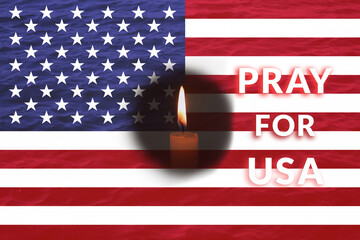 A solemn scene in Milton, Florida, where a single candle burns next to an American flag,...