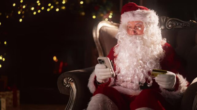 Internet fraud and cyber security, Santa inputting data of card in mobile app. Portrait of Santa Claus in Christmas night, using modern technology for ordering gifts, magic and reality, art shot
