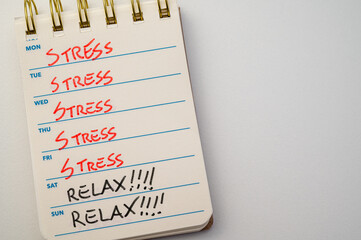 Calendar with days of the week, and words stress and burnout, written on each day. Stress, anxiety...