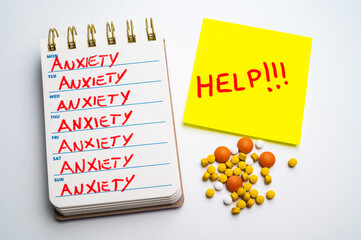Weekly planner, the word anxiety on each day, medicines next to it, and a note with a request for...