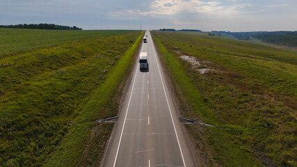 a truck is driving on the road view from a drone