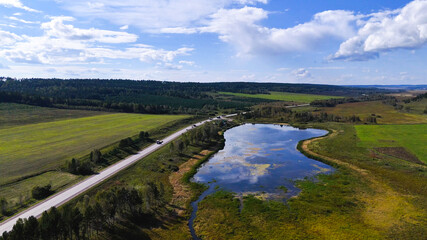 Obraz premium a truck is driving on the road view from a drone