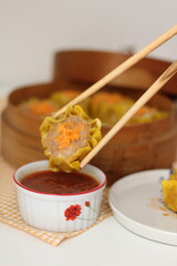 Dim sum is a traditional Chinese cuisine consisting of a variety of bite-sized dishes typically served in small portions.