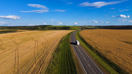 a truck is driving on the road view from a drone