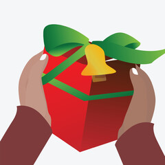 hand holding a red gift box whit green heart ribbon and bell. chrismas gift