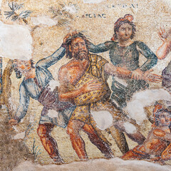 Fragment of an antique mosaic on which Marsyas receives the punishment of Apollo. Archaeological Park of Paphos. Cyprus.