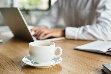 A diligent businessman in a white shirt engages in project work in a stylish office.