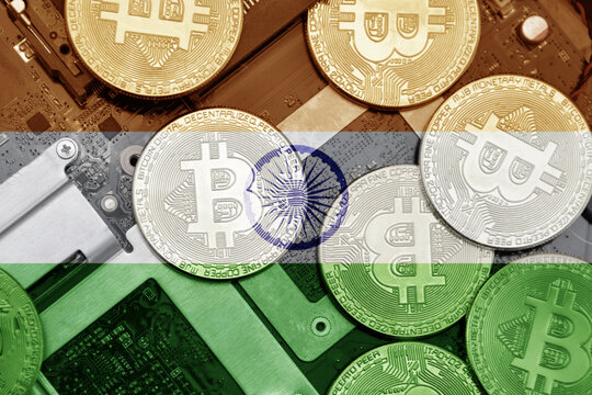 flag of india on the bitcoins with computer electronic circuit board background. bitcoin concept.