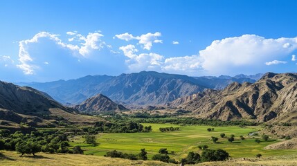 Obraz premium Scenic mountain range with clear skies and lush green valley. Ideal for outdoor adventures, nature tourism, and environmental conservation.