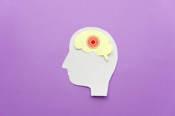 Human head with brain as pain red circle on purple background. Concept of headache, stroke disease, migraine, epilepsy, meningitis, brain tumor and dementia. Mental health.
