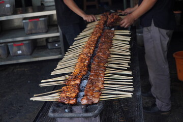 Sate or satay Maranggi is made from beef and served with sambal kecap (red chili and soy sauce). The meat is heavily marinated with spices and grilled until charred on both sides