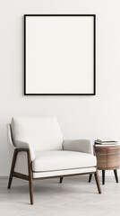 White armchair with wooden legs and a side table with books next to a blank frame.