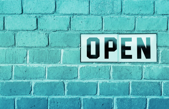 open shop message post on wall , we are open