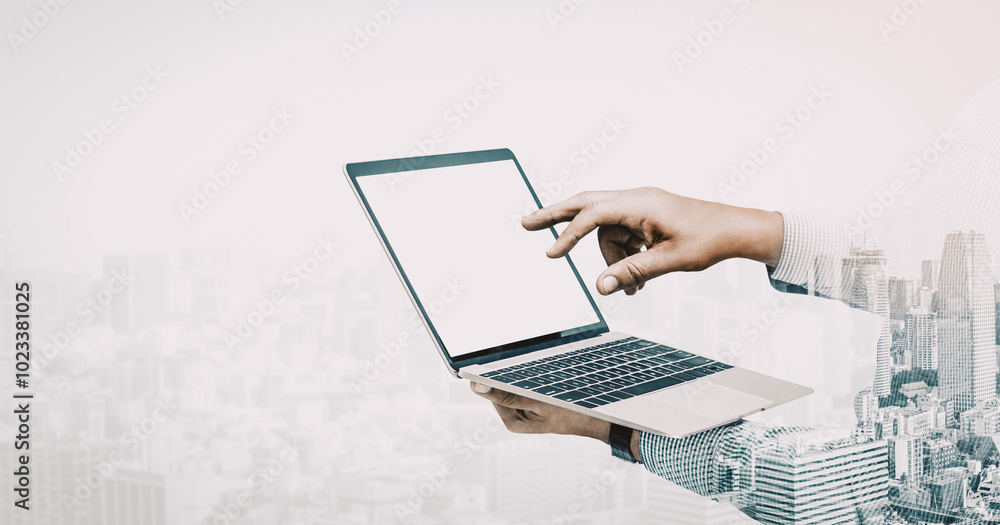 Poster double exposure image of businessman using computer on abstract modern city background. future busin