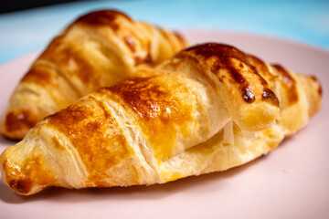 croissant on a pink plate