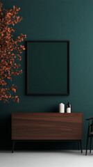 A dark green wall with a black framed picture and a wooden cabinet.
