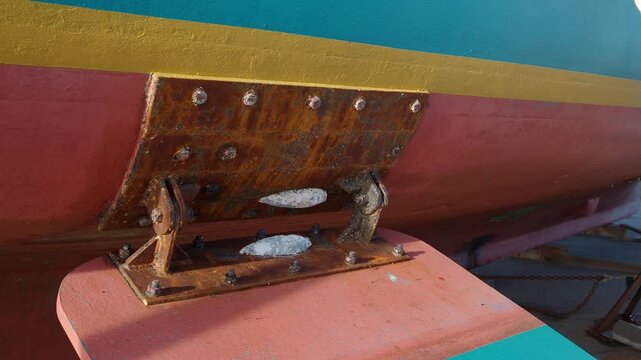 A zinc sacrificial anode on a marine vessel. The anode will dissolve protecting the iron from corrosion.