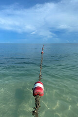 Ocean buoy for swimming on a tropical ocean beach vacation