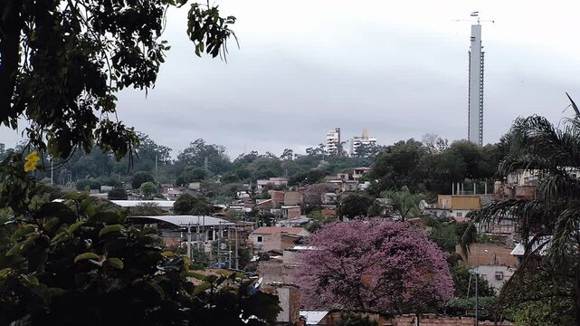 La Chacarita Shantytown and Icono Tower Side by Side in Asuncion, Paraguay - 4K