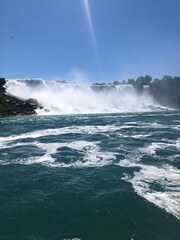 View from a boat of rough waters of the Niagara Falls.