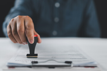 Businessman validates and manages business documents and agreements, signing a business contract...