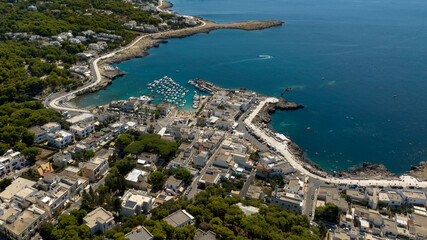 Fototapeta premium Aerial view of Santa Caterina, a hamlet of the municipality of Nardò in the province of Lecce. It is a tourist village with a small port in Salento, Italy.