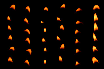 Set of glowing orange candle flames in various patterns on a black background.