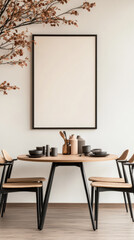 Minimalist dining room with a large framed poster above a round wooden table.