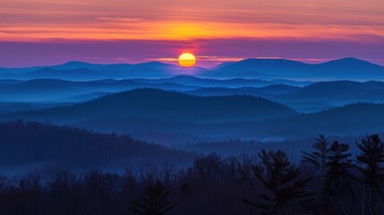 Fototapeta premium Serene Sunrise Over Misty Mountain Range