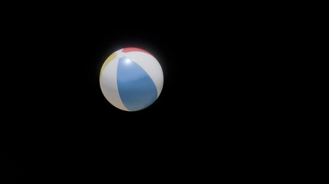 A Vibrant and Colorful Beach Ball Set Against a Solid Black Background for Contrast