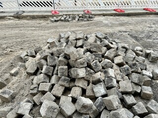On site: Old cobblestones excavated during driving lane restoring works - reusable for road...